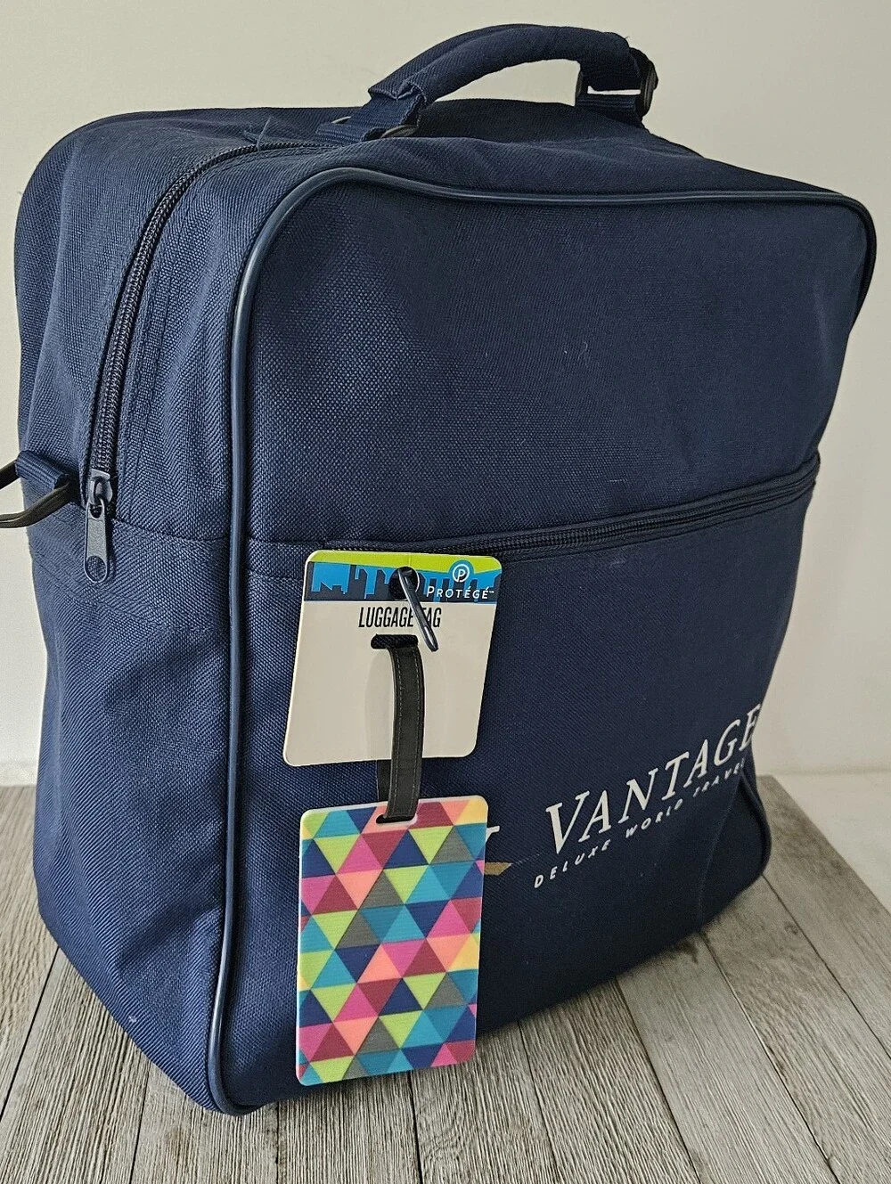 Vantage Deluxe World Travel Navy Blue Zippered Travel Bag with New Colorful ID